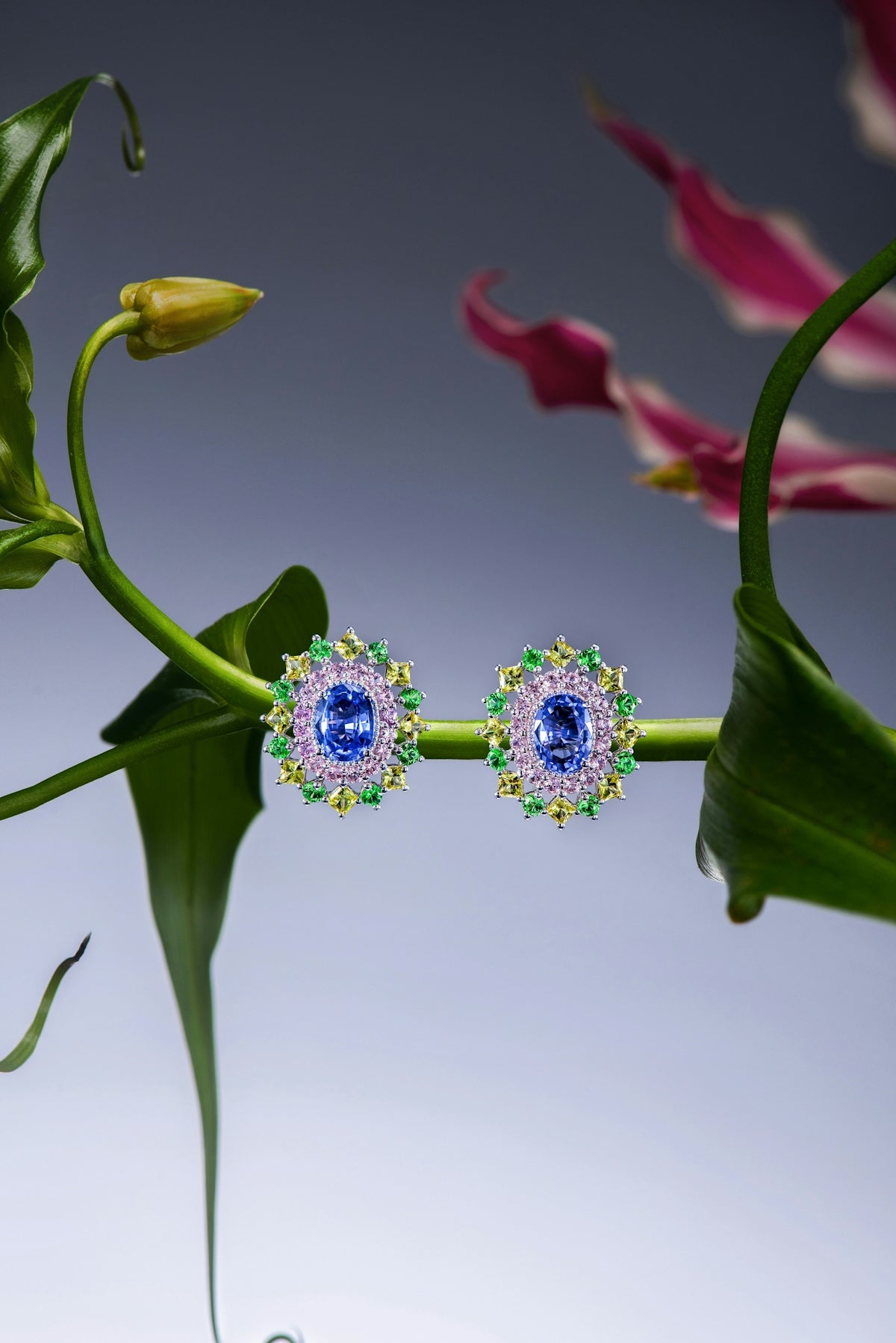 Elegant sapphire and diamond earrings on floral branch